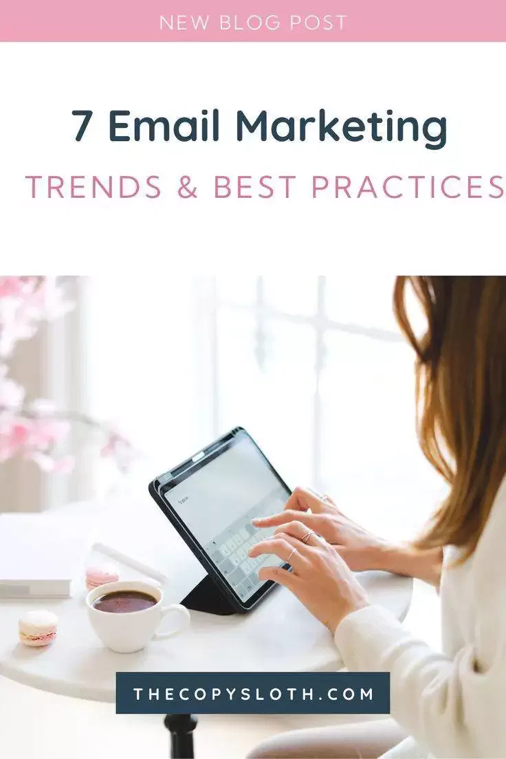 A person types on a tablet at a table with a coffee cup, macarons, and flowers; text reads 7 Email Marketing Trends & Best Practices.
