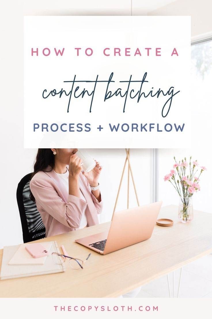 A woman in a pink blazer drinks from a cup at a desk with a laptop, notebook, and flowers. A large sign above her reads, How to create a content batching process + workflow.